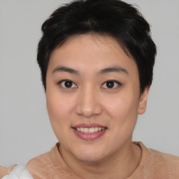 Joyful asian young-adult female with short  brown hair and brown eyes