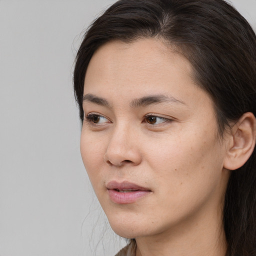 Neutral white young-adult female with long  black hair and brown eyes