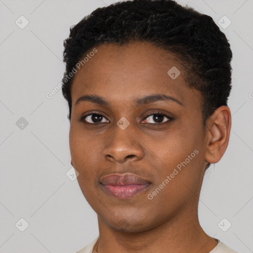 Joyful black young-adult female with short  black hair and brown eyes