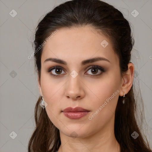 Neutral white young-adult female with long  brown hair and brown eyes