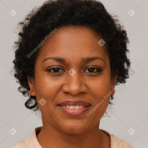 Joyful black adult female with short  brown hair and brown eyes