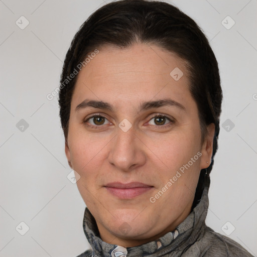 Joyful white adult female with short  brown hair and brown eyes