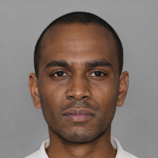 Neutral latino young-adult male with short  brown hair and brown eyes