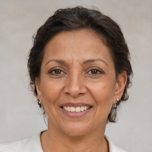 Joyful white adult female with short  brown hair and brown eyes