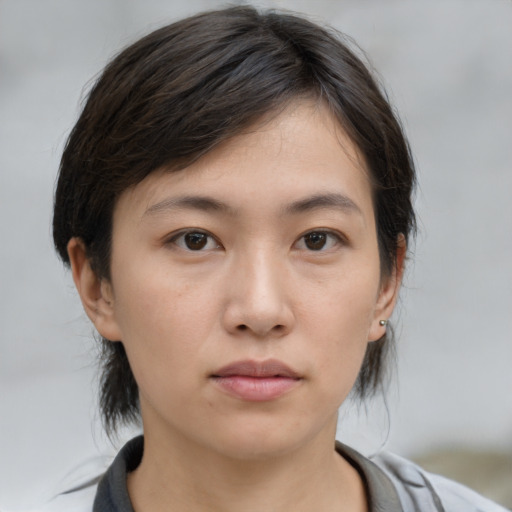 Neutral asian young-adult female with medium  brown hair and brown eyes
