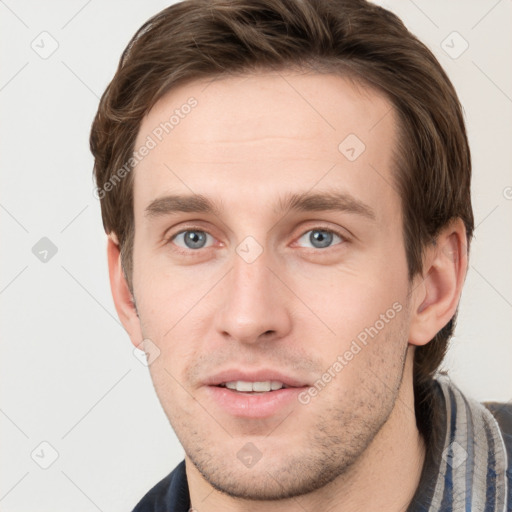 Neutral white young-adult male with short  brown hair and grey eyes