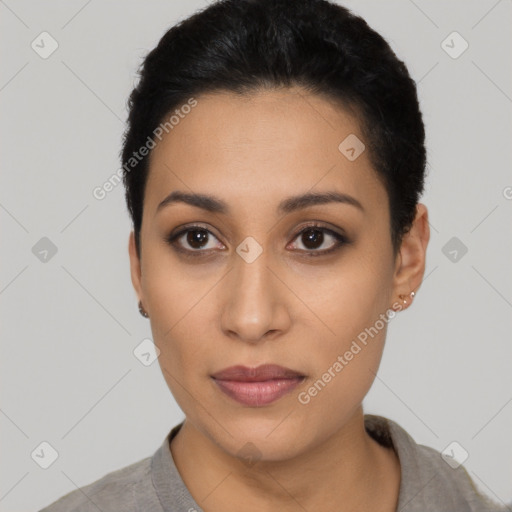 Joyful latino young-adult female with short  black hair and brown eyes