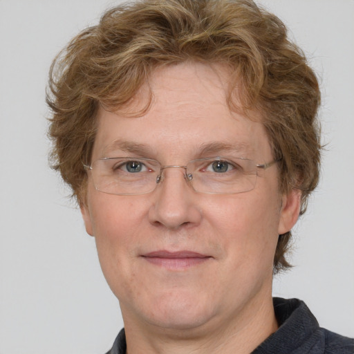 Joyful white adult male with short  brown hair and blue eyes