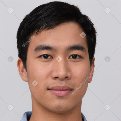 Joyful asian young-adult male with short  black hair and brown eyes