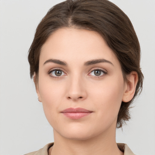 Neutral white young-adult female with medium  brown hair and brown eyes