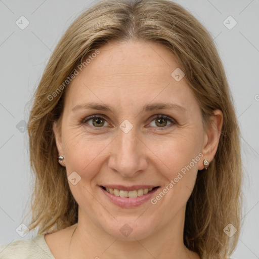 Joyful white adult female with medium  brown hair and brown eyes