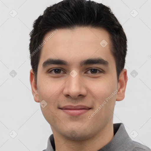 Joyful white young-adult male with short  black hair and brown eyes