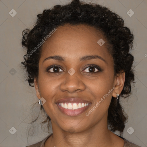 Joyful black young-adult female with medium  brown hair and brown eyes