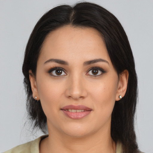 Joyful white young-adult female with long  brown hair and brown eyes