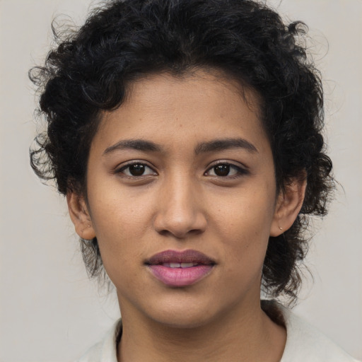 Joyful latino young-adult female with medium  black hair and brown eyes