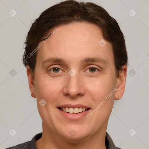 Joyful white adult male with short  brown hair and grey eyes