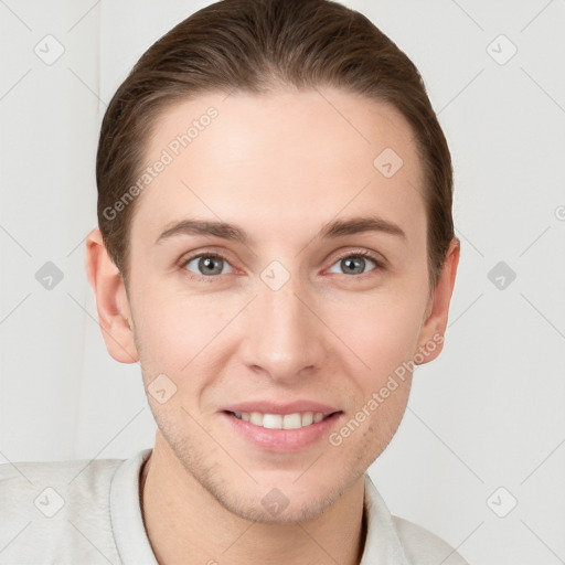 Joyful white young-adult female with short  brown hair and grey eyes