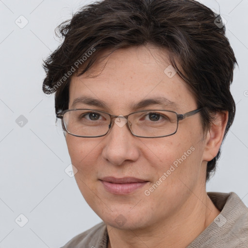 Joyful white adult female with short  brown hair and brown eyes