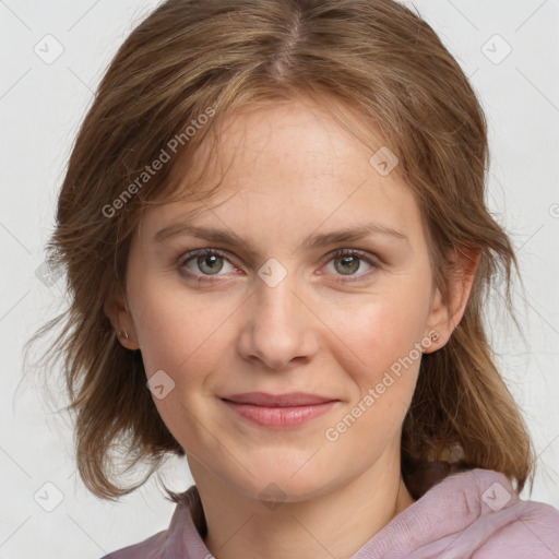 Joyful white young-adult female with medium  brown hair and blue eyes