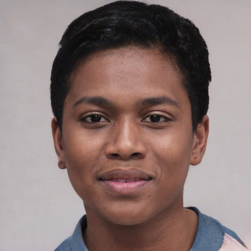 Joyful black young-adult female with short  black hair and brown eyes