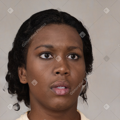 Neutral black young-adult female with medium  brown hair and brown eyes