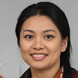 Joyful asian young-adult female with medium  brown hair and brown eyes