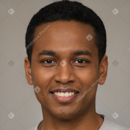 Joyful black young-adult male with short  black hair and brown eyes