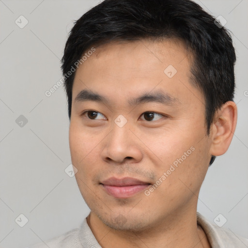 Joyful white young-adult male with short  black hair and brown eyes