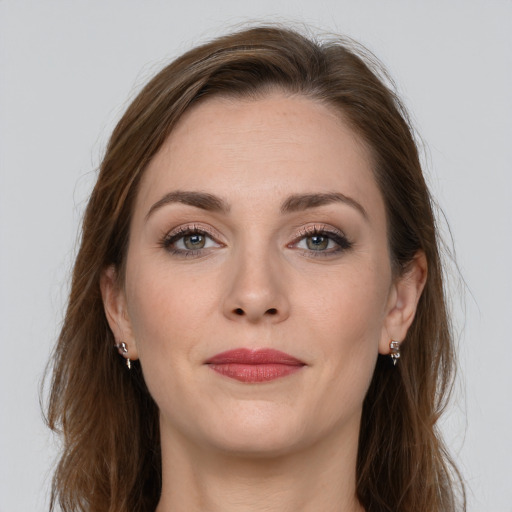 Joyful white young-adult female with long  brown hair and grey eyes