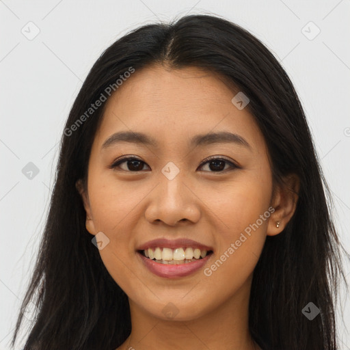 Joyful asian young-adult female with long  brown hair and brown eyes