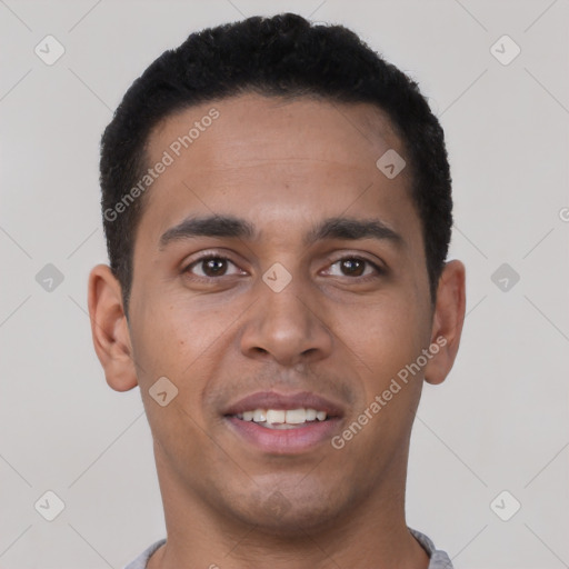 Joyful latino young-adult male with short  brown hair and brown eyes