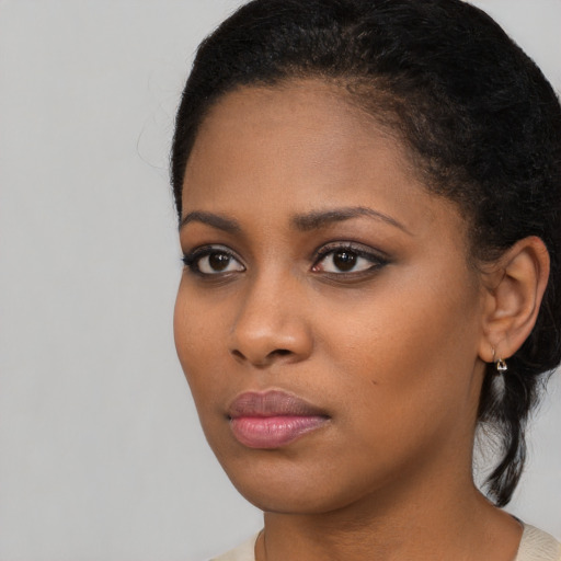 Neutral black young-adult female with long  black hair and brown eyes