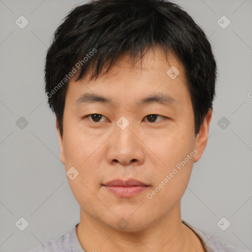 Neutral asian young-adult male with short  brown hair and brown eyes