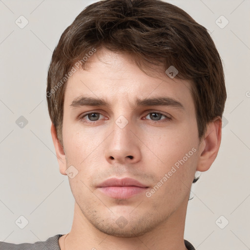 Neutral white young-adult male with short  brown hair and grey eyes