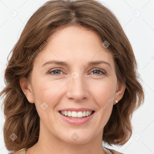 Joyful white young-adult female with medium  brown hair and green eyes