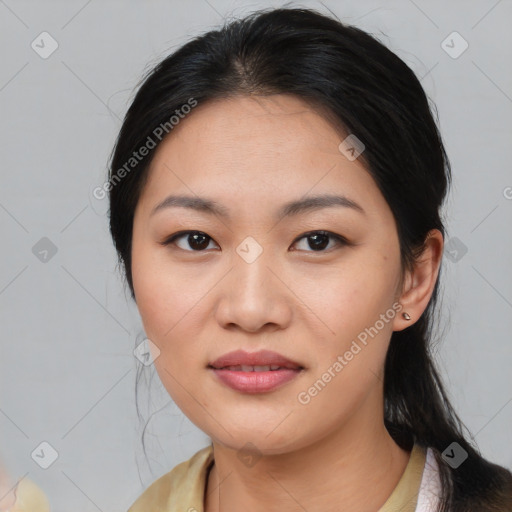 Joyful asian young-adult female with medium  black hair and brown eyes