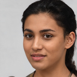 Joyful latino young-adult female with medium  brown hair and brown eyes