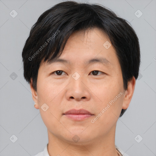 Neutral asian adult male with short  brown hair and brown eyes