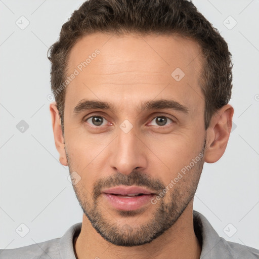 Neutral white young-adult male with short  brown hair and brown eyes