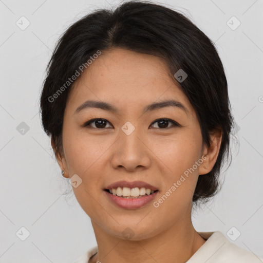 Joyful asian young-adult female with medium  brown hair and brown eyes