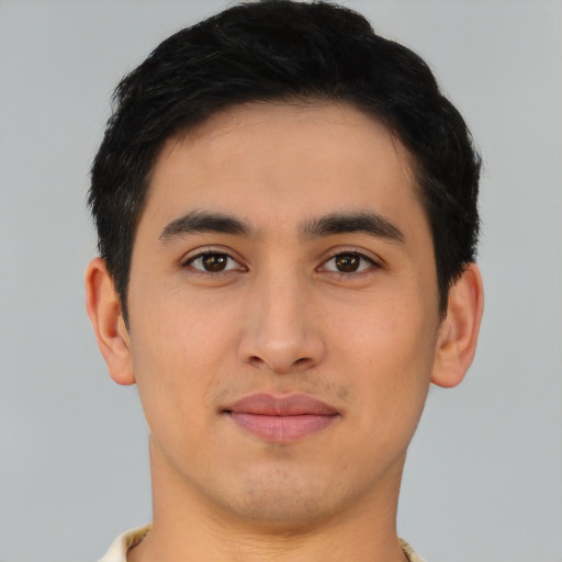 Joyful asian young-adult male with short  brown hair and brown eyes