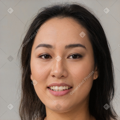 Joyful asian young-adult female with long  brown hair and brown eyes