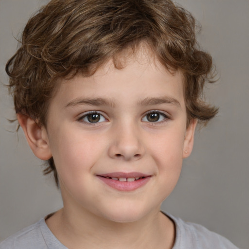 Joyful white child male with short  brown hair and brown eyes