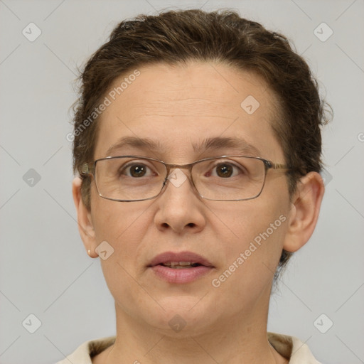 Joyful white adult female with short  brown hair and brown eyes