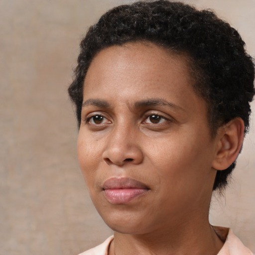 Neutral latino adult female with short  black hair and brown eyes
