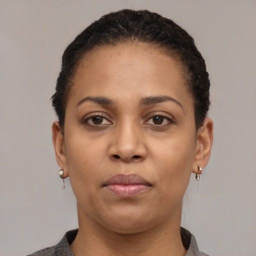 Neutral black young-adult female with short  black hair and brown eyes