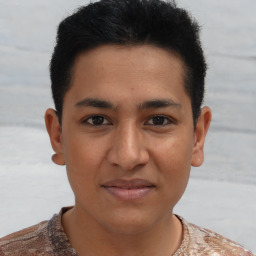 Joyful latino young-adult male with short  brown hair and brown eyes