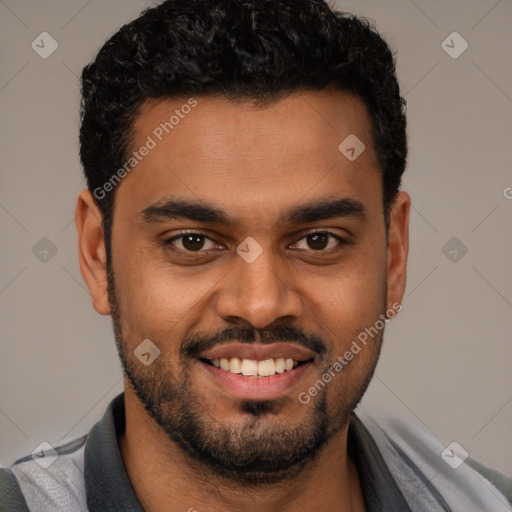 Joyful white young-adult male with short  black hair and brown eyes