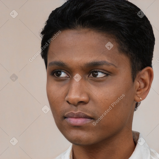 Neutral latino young-adult male with short  black hair and brown eyes