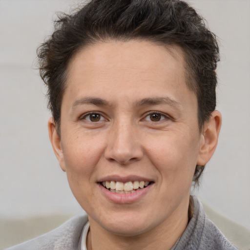 Joyful white adult female with short  brown hair and brown eyes